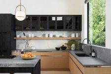 a minimalist kitchen with contrasts, with stained cabinets, concrete countertops and a backspalsh, black upper cabinets and a large kitchen island with seats