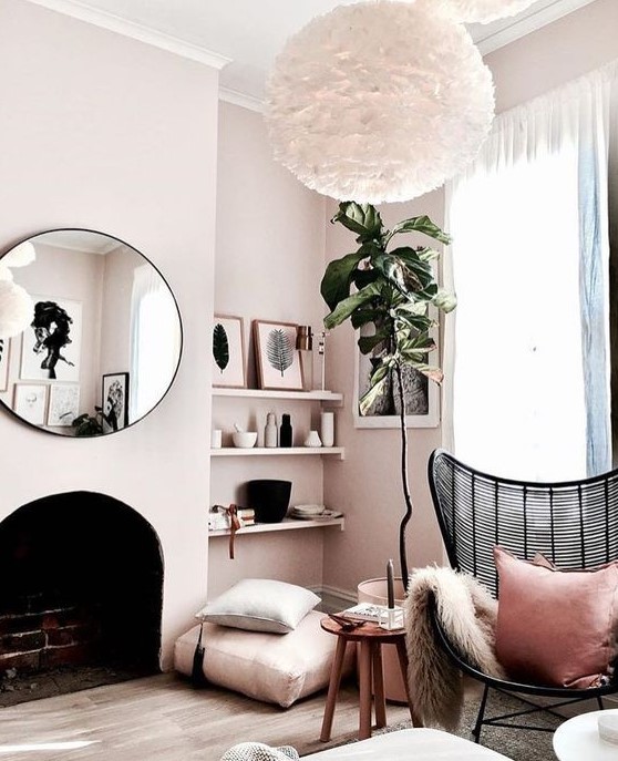 an arched fireplace with floor cushions, built-in shelves and a potted plant plus a rattan chair for a cozy nook