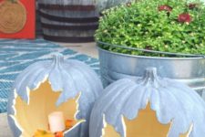 candle lanterns carved of faux pumpkins with leaves inside are great for decorating your home both indoors and outdoors