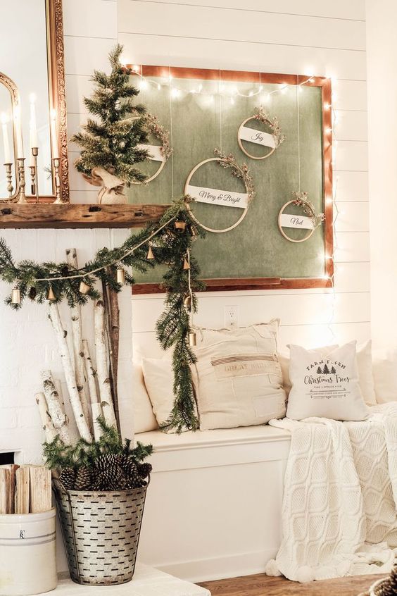 evergreens, pinecones, branches, wood and lots of lights make this little nook very cozy and very welcoming