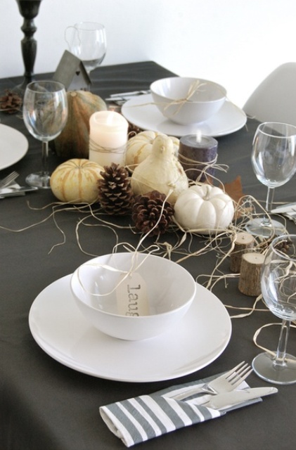 gourds and pumpkins, hay and pinecones, tree stumps and simple white porcelain for a modern Thanksgiving tablescape