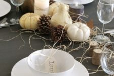 gourds and pumpkins, hay and pinecones, tree stumps and simple white porcelain for a modern tablescape