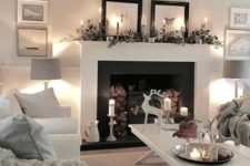 lots of candles and lights and a non-working hearth with firewood make the living room more welcoming