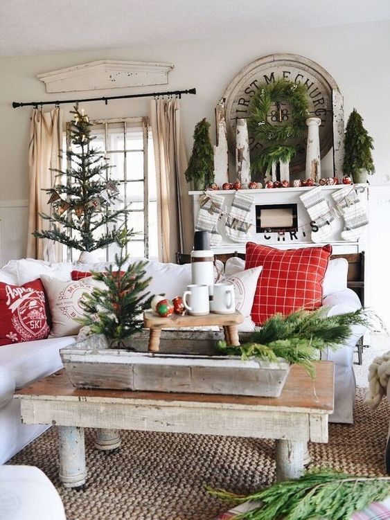 lots of evergreens here and there, a Christmas tree make the living room very holiday like