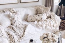lots of fringe and beaded pillows and a chunky knit blanket make the living room amazingly cozy and wlecoming