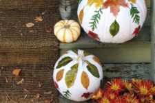white pumpkins with fall leaf decoupage and a bronze one will decorate your steps easily