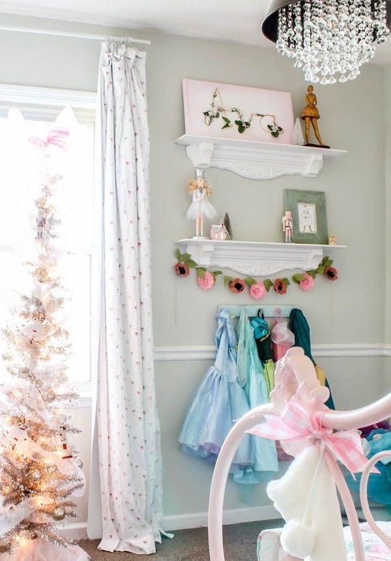 a beautiful silver Christmas tree decorated with silver and white ornaments is a lovely idea for a kid's room