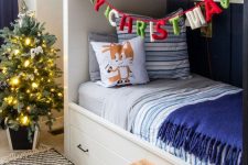 a colorful letter banner and a Christmas tree with lights will bring a cool holiday feel to the space