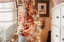 a duo of Christmas trees with lights and various ornaments and decor is a perfect idea for pulling off holiday decor in your kids’ room