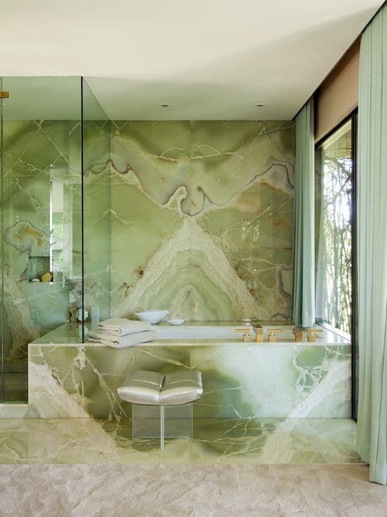 a fantastic green onyx bathroom with clear glass space dividers and a stool is a jac-dropping idea for a luxury home