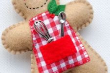 a felt cook gingerbread ornament in an apron, with kitchen utensils is a cute and fun Christmas decoration to rock