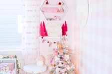 a lovely flocked Christmas tree with pink and blush ornaments, small hot pink tinsel trees will help to create a mood here