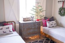 a non-decorated Christmas tree, plaid pillows and some lights for a slight holiday touch in your kids’ room