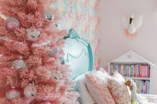 a pink Christmas tree with various ornaments will easily bring a holiday feel to your kid’s room and will make it amazing