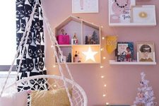 a star, some lights and a white Christmas tree with ornaments will create a holiday ambience in your kid’s room