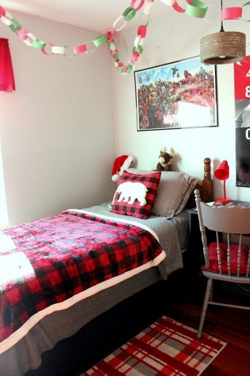 plaid bedding and a rug, a colorful Christmas chain garland will bring a holiday feel to your kids' room easily