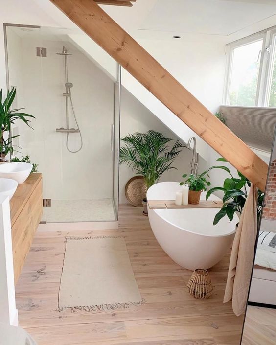 a minimalist bathroom with a wooden beam, a large window, a tub and a shower space and a floating wooden vanity