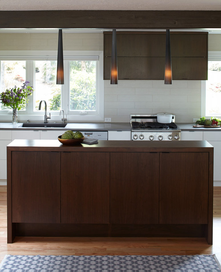 a rich-stained and white mid-century modern kitchen with catchy pendant lamps  (Mosaik Design &amp; Remodeling)