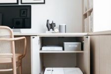 a cabinet with a hidden printed is a cool idea to organize keeping your space minimalist and clean