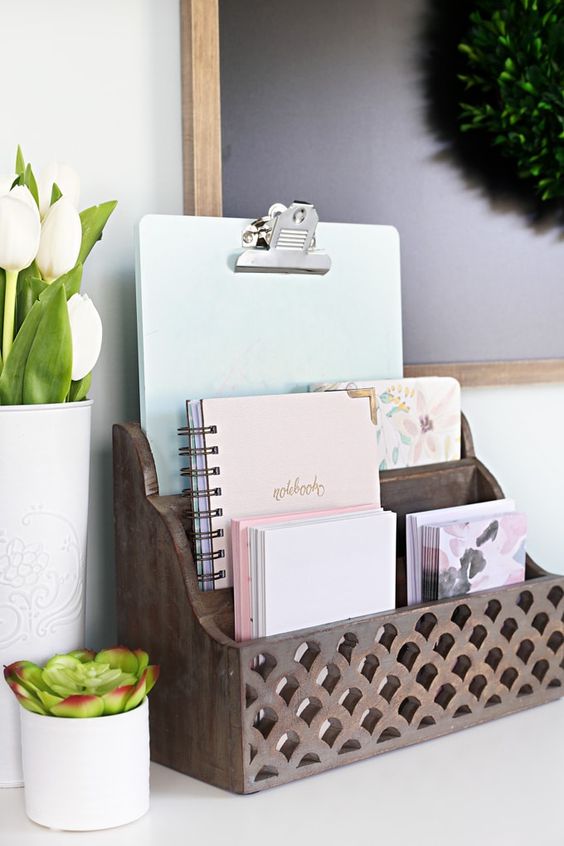 a carved wooden holder for documents and notebooks is a cool piece to add a rustic touch and organize your office