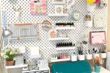 a pegboard with a numbe rof shelves, holders and vases – you can design such a floating storage unit as you want