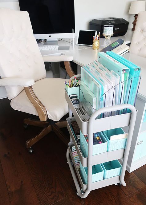 a small utility cart styled for storing files, with plastic boxes for various small stuff that you use