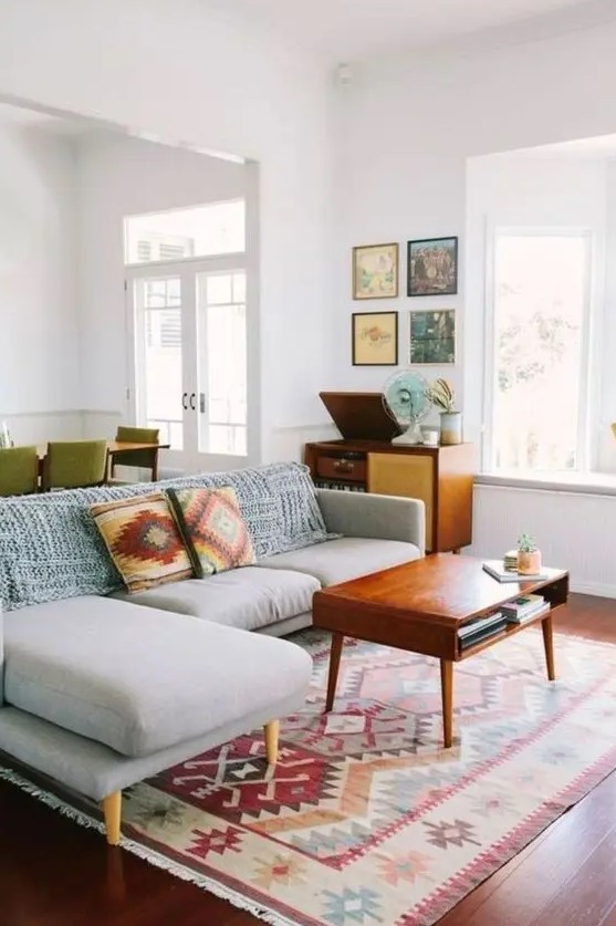 abstract pillows and a rug are great for sprucing up the space and making it mid-century modern