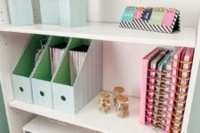 an open storage unit with various holders and organizers is a perfect for piece for every kind of office stuff