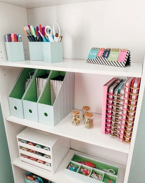 an open storage unit with various holders and organizers is a perfect for piece for every kind of office stuff