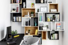 mismatching box wall-mounted shelving units double as decoration in a home office