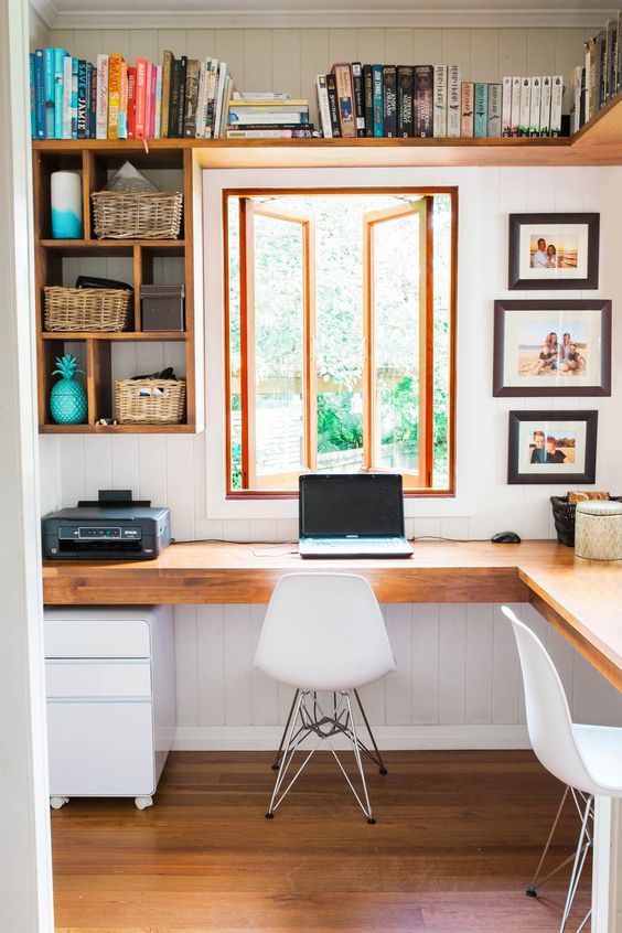 wall-mounted open shelves plus an L-shaped shared desk will maximize functionality and let you work comfortably