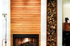 a built-in fireplace and a niche for firewood next to it add warmth and coziness to the space