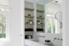 a contemporary bathroom with a large niche, with a double sink and niche shelves inside is a cool idea