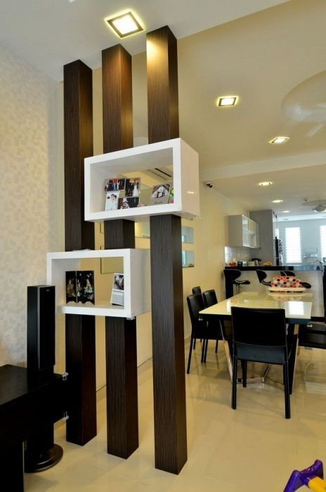 a creative doorway storage unit with dark stained beams and open shelves for storage is a lovely idea to separate spaces