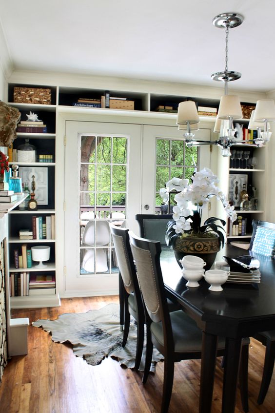 a doorway wall with open shelves all over is a stylish and cool idea to store a lot of stuff you have, necessary and unnecessary easily