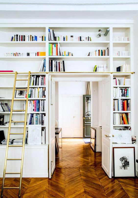 a doorway with open shelves, a ladder to get books is a lovely idea to create a lightweight bookcase that won't take much space