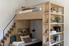 a light stained bunk bed with open shelving and drawers for storage is a cool modern solution for a small kids’ room
