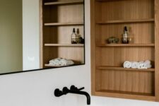 a minimalist bathroom with niche and shelves done with wood completely is a stylish space that adds warmth here