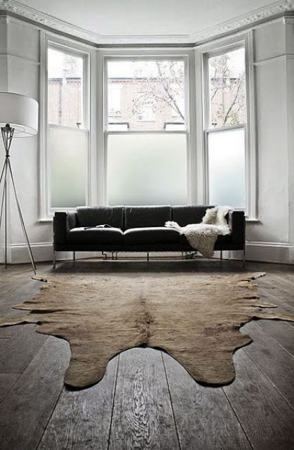 a modern living room with partly frosted glass windows is a stylish space with plenty of privacy and enough light
