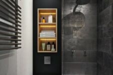 an almost pure-black bathroom with stone wall tiles