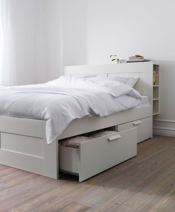 a neutral IKEA Brimnes bed with drawers and a storage headboard is a cool solutioin for a small space