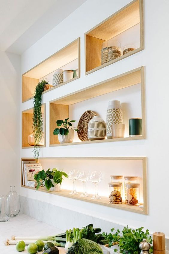 cool niche shelves with stained wooden framing and lights will display your stuff at their best