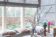 neutral fabric shades covering the whole corner window if necssary are a cool way to keep the space more private yet modern