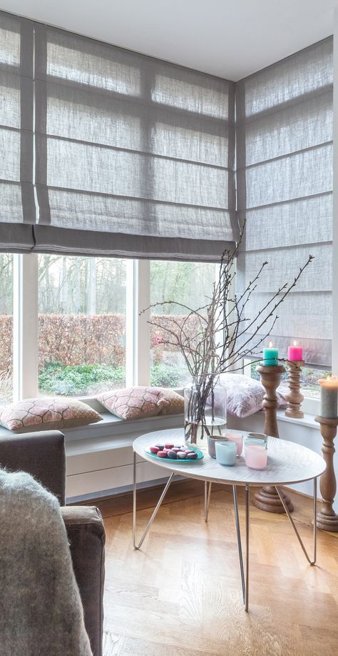 neutral fabric shades covering the whole corner window if necssary are a cool way to keep the space more private yet modern