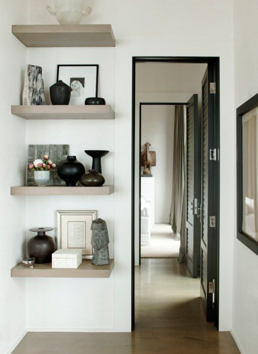 open shelves attached next to the doorway is a great idea to show off beautiful decor and accessories without wasting space