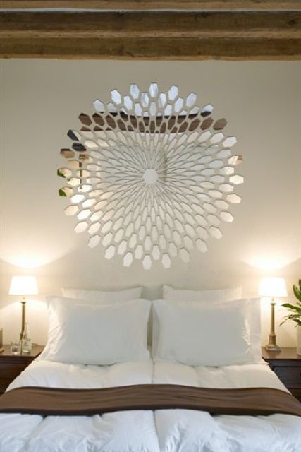 a beautiful mirror decoration over the bed is a fantastic solution instead of a usual artwork or a headboard, it will give a touch of shine to the space