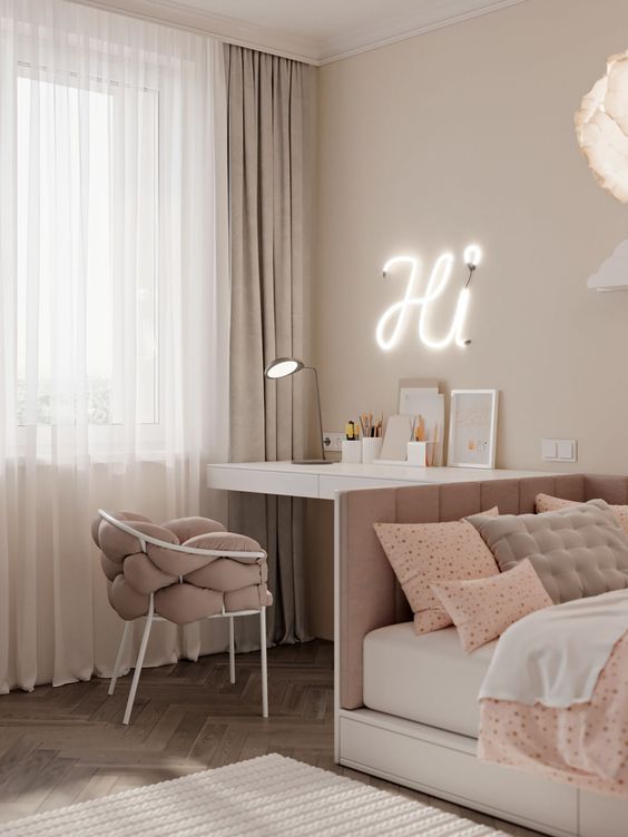 a beautiful white and dusty pink teen girl bedroom with various printed textiles, a neon light and a table lamp