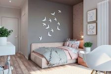 a lovely pink and grey teen girl bedroom with a bed in an alcove, bird art, potted greenery and cute artworks