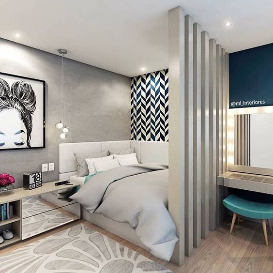 a modern teen girl bedroom in grey and navy, with a sleeping and studying zone spearated and lots of prints