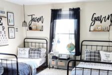 a stylish shared teen boy bedroom with metal beds, layered rugs, a desk with drawers and printed textiles